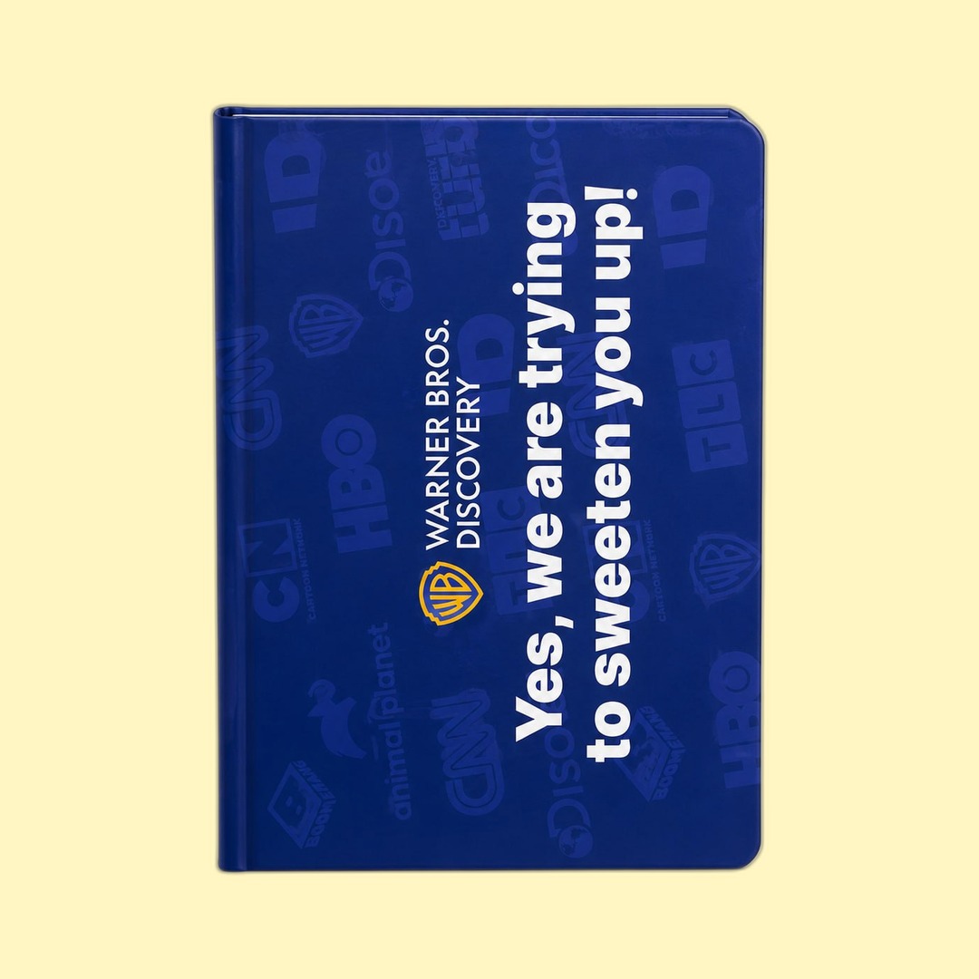 Warner Bros. Discovery channel-logo pattern notebook produced by Sense2